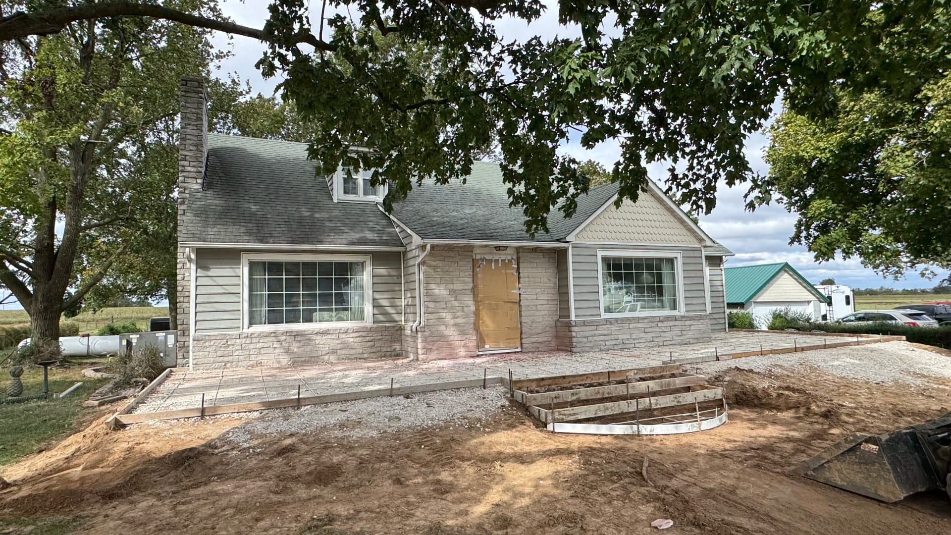 Gallery photos for Old Front Steps Replaced With a Wide Concrete Patio and Entry: Image #1