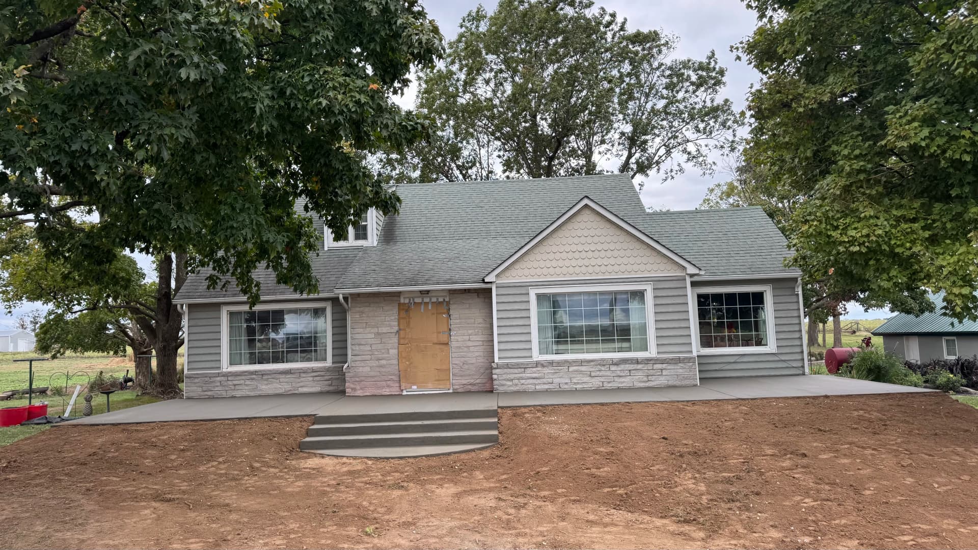 Gallery photos for Old Front Steps Replaced With a Wide Concrete Patio and Entry: Image #3